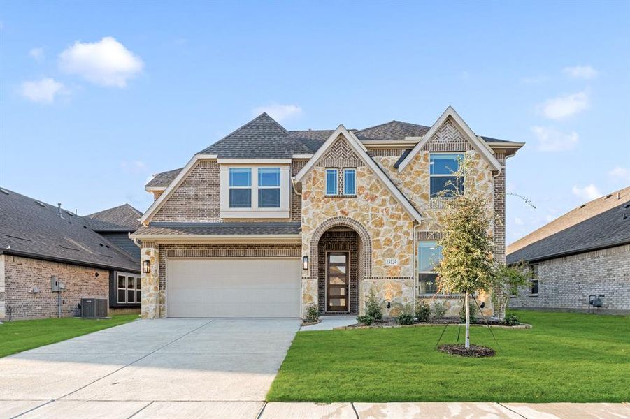 Front exterior of a new home in Woodstone, Providence Village, TX, highlighting curb appeal (Image 21). Front exterior of a new home in Woodstone, Providence Village, TX, highlighting curb appeal (Image 21).