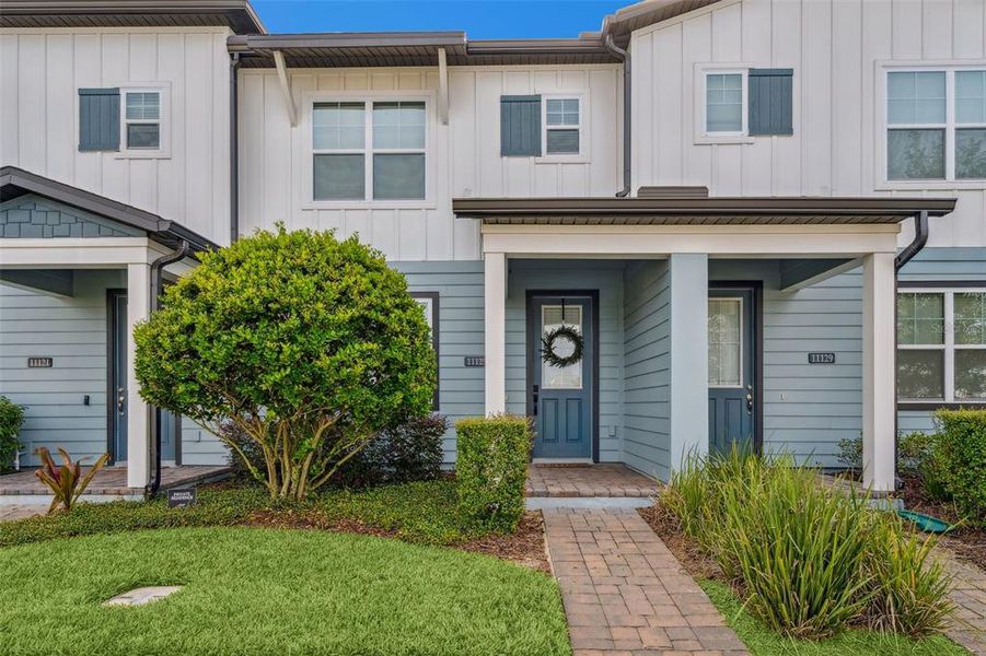 Front exterior of a new home in , Winter Garden, FL, highlighting curb appeal (Image 1). Front exterior of a new home in , Winter Garden, FL, highlighting curb appeal (Image 1).