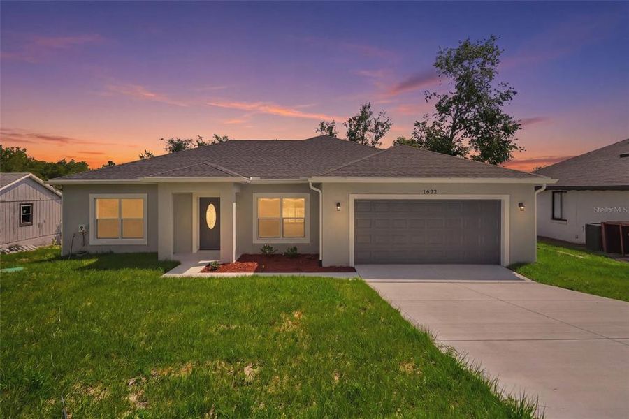 Front exterior of a new home in , Deltona, FL, highlighting curb appeal (Image 22).