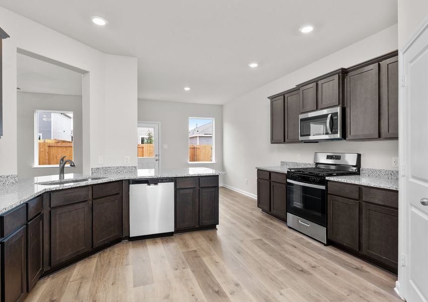 The kitchen has designer wood cabinetry. The kitchen has designer wood cabinetry.