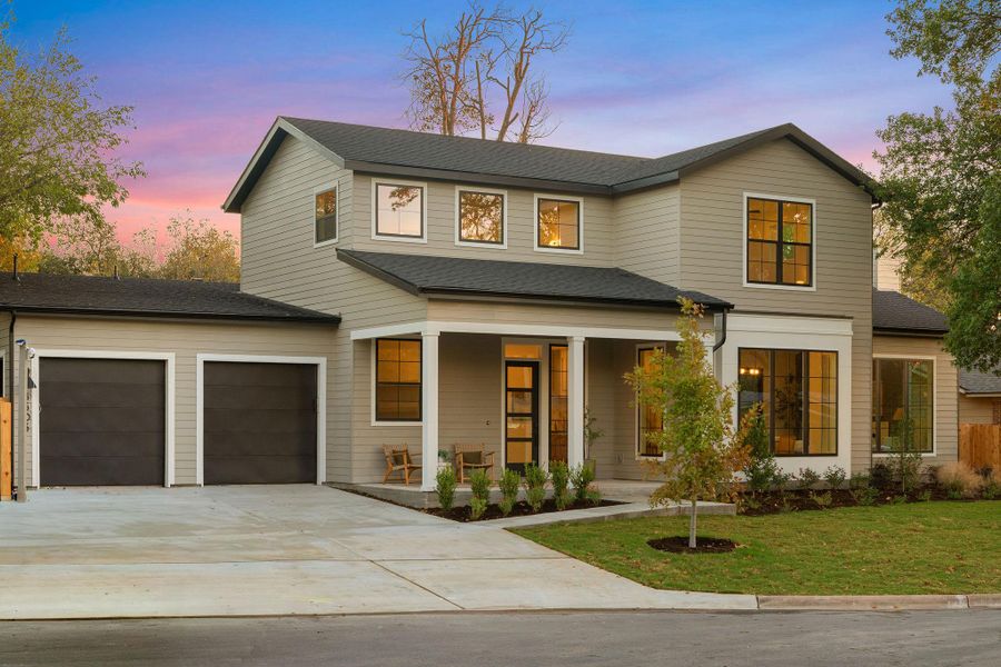 View of front facade with covered porch, driveway, a front yard, and a shingled roof View of front facade with covered porch, driveway, a front yard, and a shingled roof