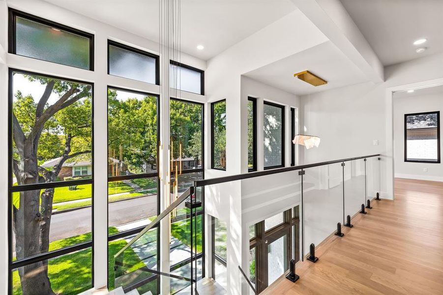 Stairway featuring wood finished floors and recessed lighting Stairway featuring wood finished floors and recessed lighting
