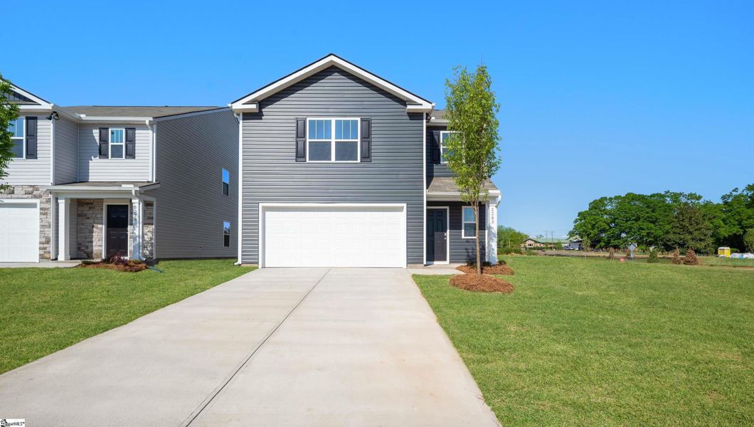 Front exterior of a new home in Durbin Meadows, Fountain Inn, SC, highlighting curb appeal (Image 1).