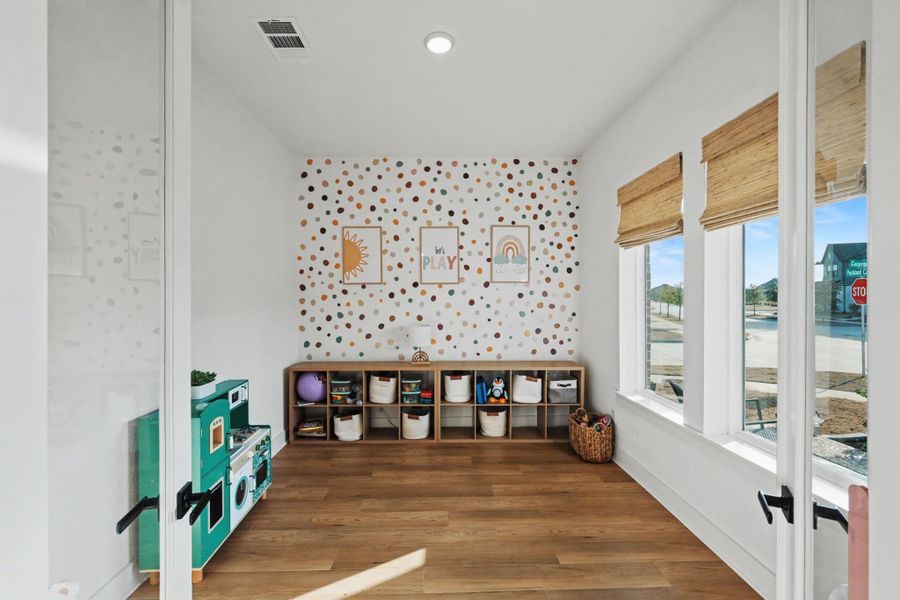Charming flex space filled with natural light, ideal for a playroom, home office, or creative studio. Large windows and warm wood flooring create a bright, versatile retreat designed to adapt to your lifestyle.