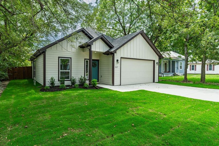 Front exterior of a new home in , Greenville, TX, highlighting curb appeal (Image 22). Front exterior of a new home in , Greenville, TX, highlighting curb appeal (Image 22).