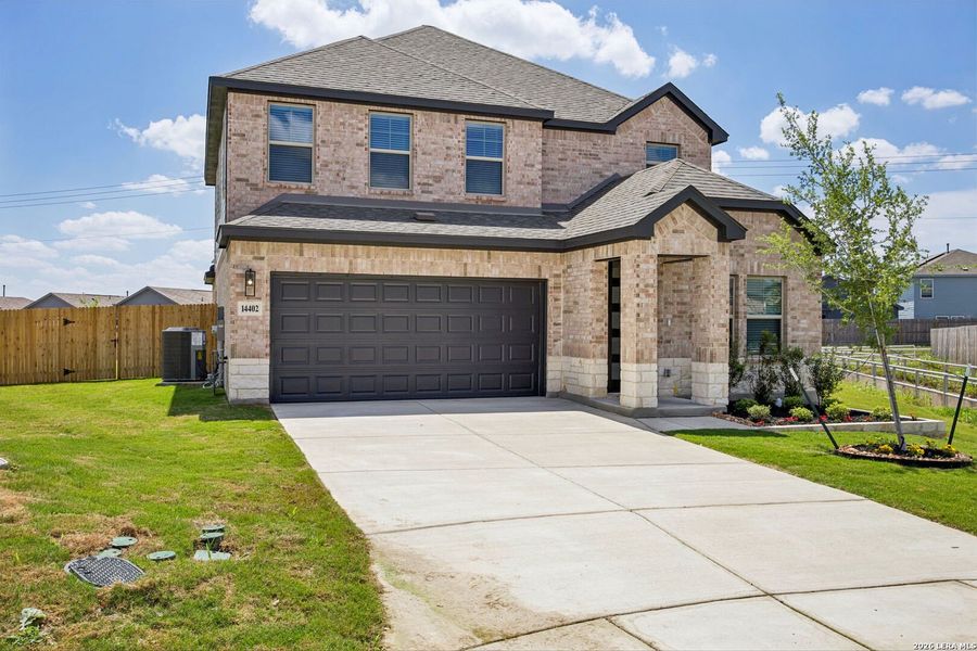 Front exterior of a new home in Kallison Ranch, San Antonio, TX, highlighting curb appeal (Image 20).