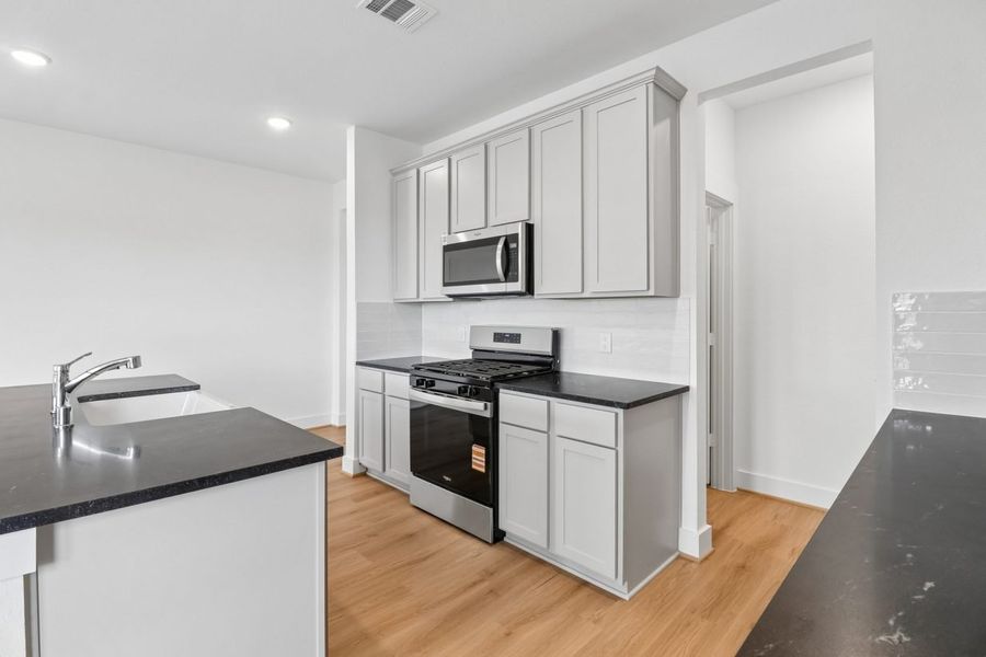 Furnished interior view inside a new home in Trinity Grove, Spring (Image 8).