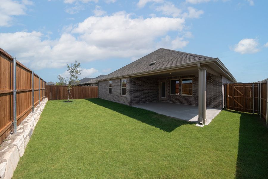 Exterior details and patio area of a home in Whitewing Trails, Princeton (Image 2). Exterior details and patio area of a home in Whitewing Trails, Princeton (Image 2).