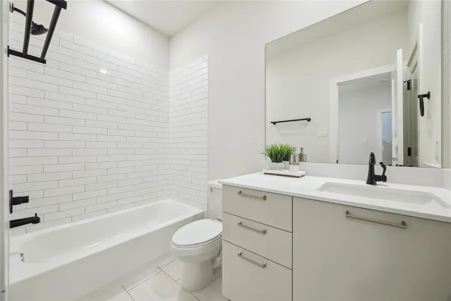 Modern and bright first-floor bathroom featuring sleek finishes and a spacious design. Modern and bright first-floor bathroom featuring sleek finishes and a spacious design.
