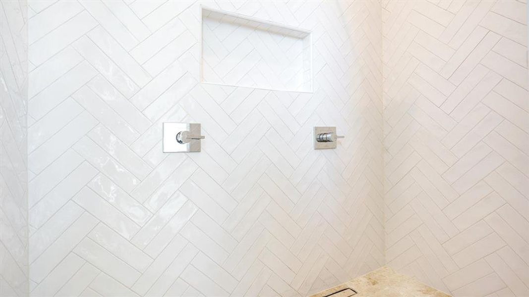 Interior details featuring a tile shower