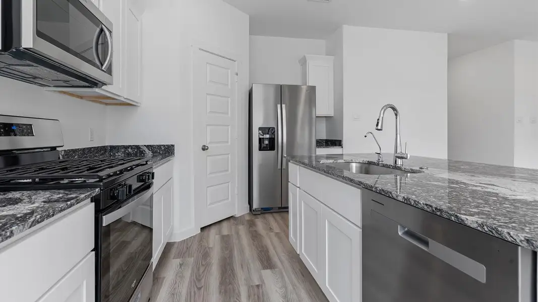 Furnished interior view inside a new home in Caldwell Crossing, Iowa Colony (Image 5). Furnished interior view inside a new home in Caldwell Crossing, Iowa Colony (Image 5).