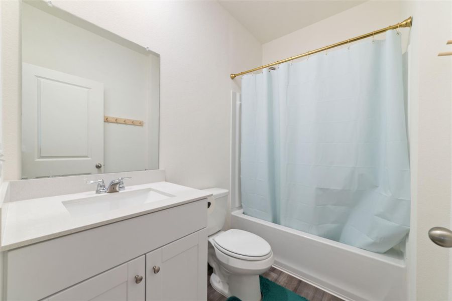 Furnished interior view inside a new home in Sunterra, Katy (Image 14).