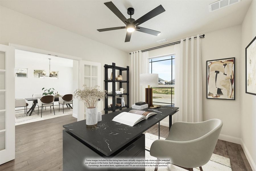 Home office with dark marble desk, ceiling fan, and open view to dining room