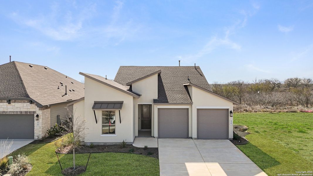 Front exterior of a new home in Nolte Farms, Seguin, TX, highlighting curb appeal (Image 28). Front exterior of a new home in Nolte Farms, Seguin, TX, highlighting curb appeal (Image 28).