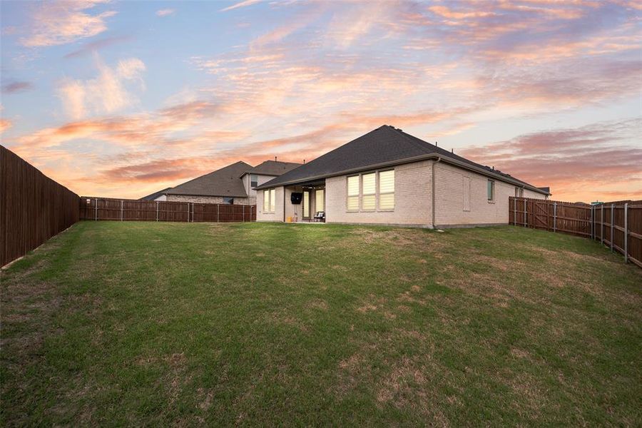 Expansive green lawn providing ample outdoor space