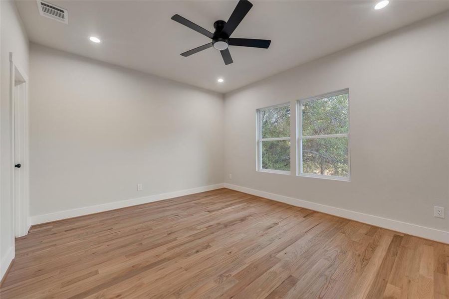 Unfurnished room featuring light hardwood / wood-style floors and ceiling fan