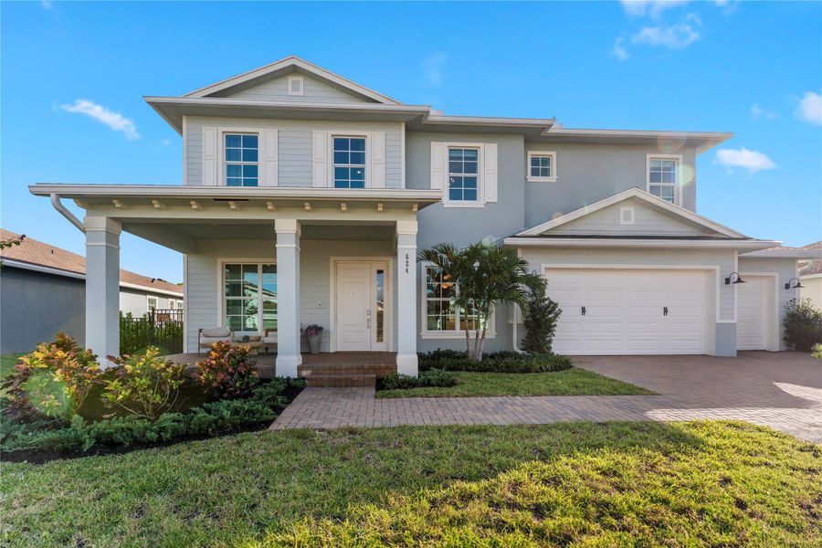 Exterior details and patio area of a home in Arden: The Waterford Collection, Loxahatchee (Image 22).