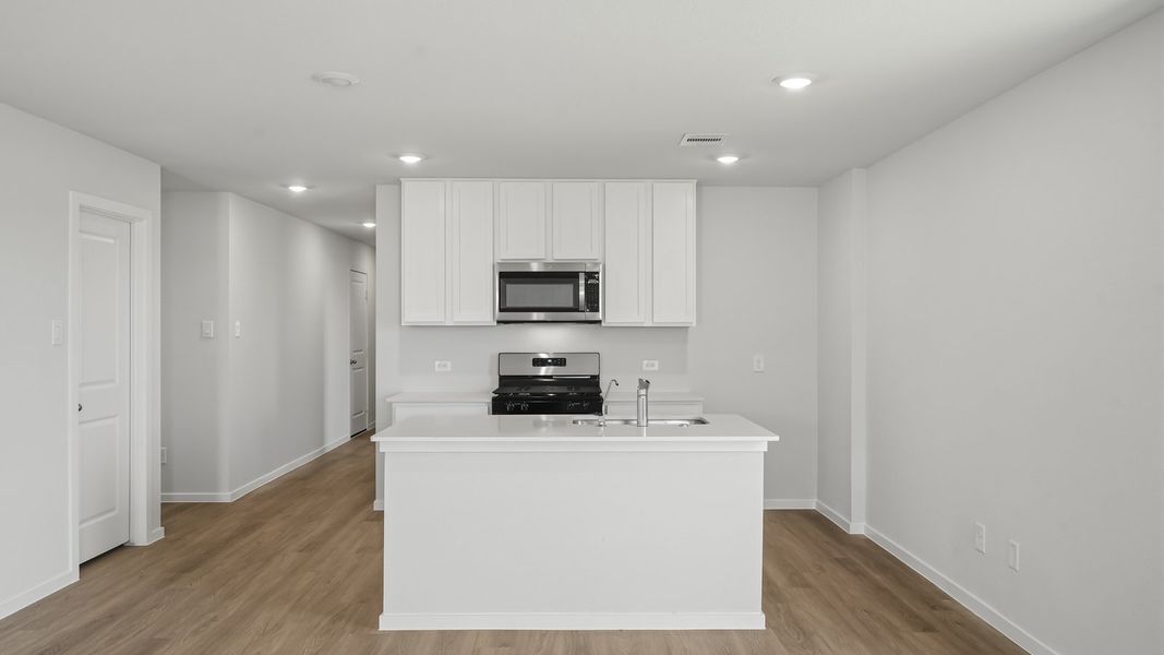 Furnished interior view inside a new home in Sunterra, Katy (Image 9).
