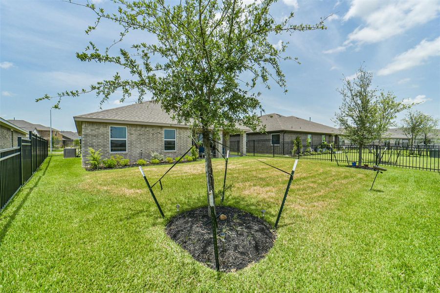 Exterior details and patio area of a home in Sunterra, Katy (Image 3).