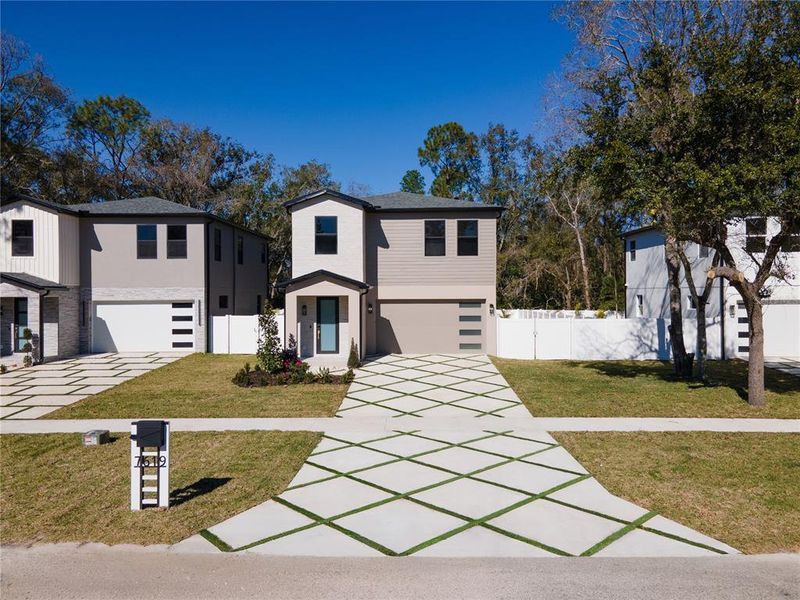 Front exterior of a new home in , Tampa, FL, highlighting curb appeal (Image 30).
