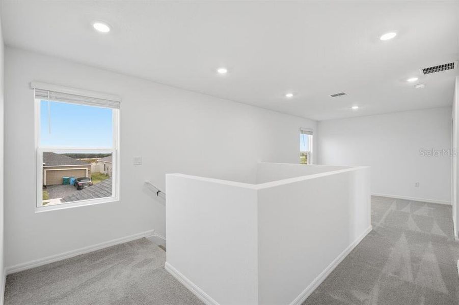 Spacious, unfurnished interior of a new home in Waterstone, Groveland (Image 24).