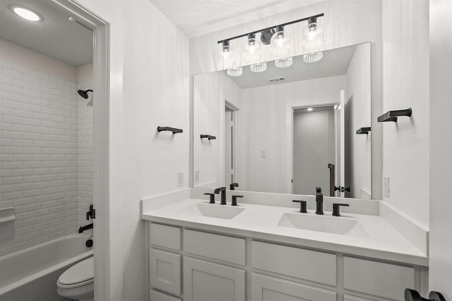 Full bath featuring shower / tub combination, double vanity Full bath featuring shower / tub combination, double vanity