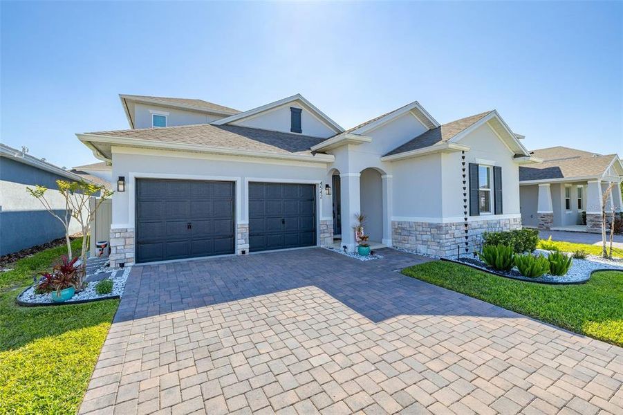 Front exterior of a new home in Hartwood Landing, Clermont, FL, highlighting curb appeal (Image 25).