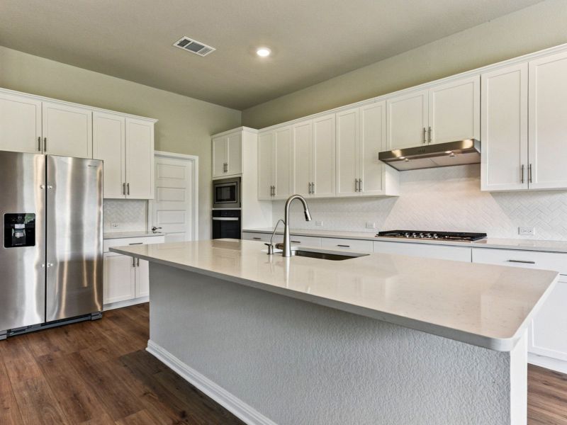 Furnished interior view inside a new home in Big Sky Ranch - Executive Collection, Dripping Springs (Image 3).