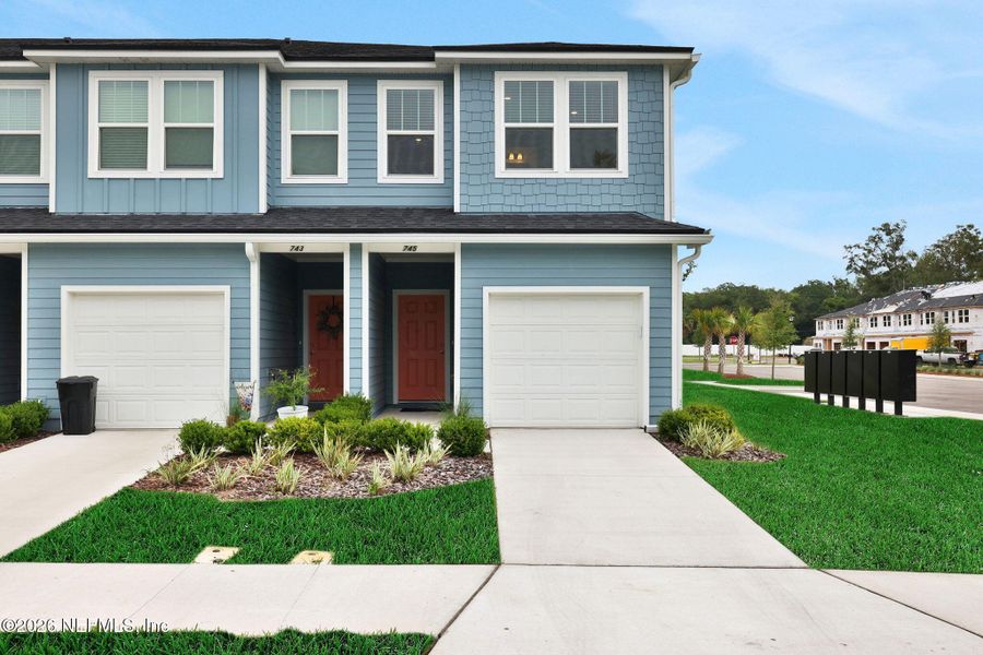 Front exterior of a new home in Kasen Oaks, Jacksonville, FL, highlighting curb appeal (Image 22).