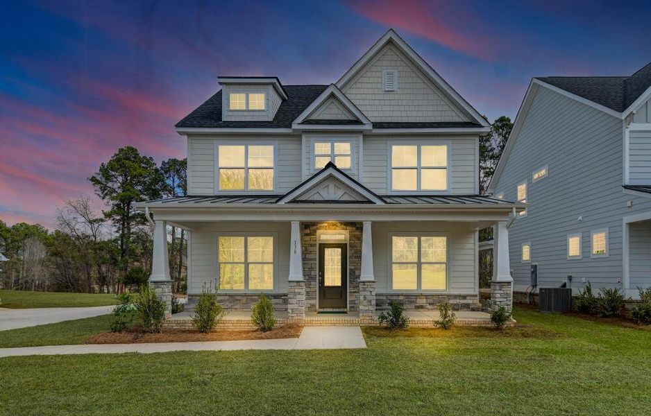 Front exterior of a new home in Clubside Reserve at Summerlake, Lexington, SC, highlighting curb appeal (Image 2). Front exterior of a new home in Clubside Reserve at Summerlake, Lexington, SC, highlighting curb appeal (Image 2).