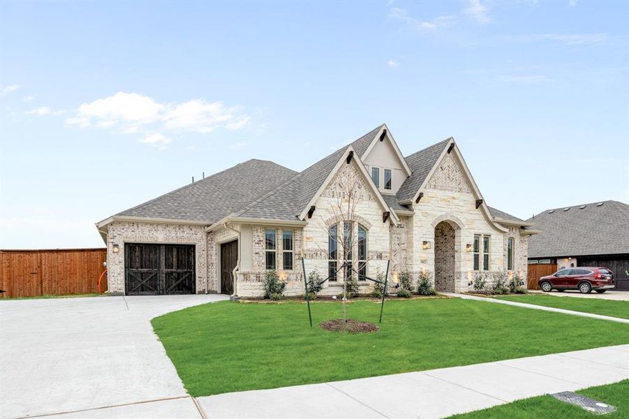 Front exterior of a new home in Hayes Crossing, Midlothian, TX, highlighting curb appeal (Image 24).