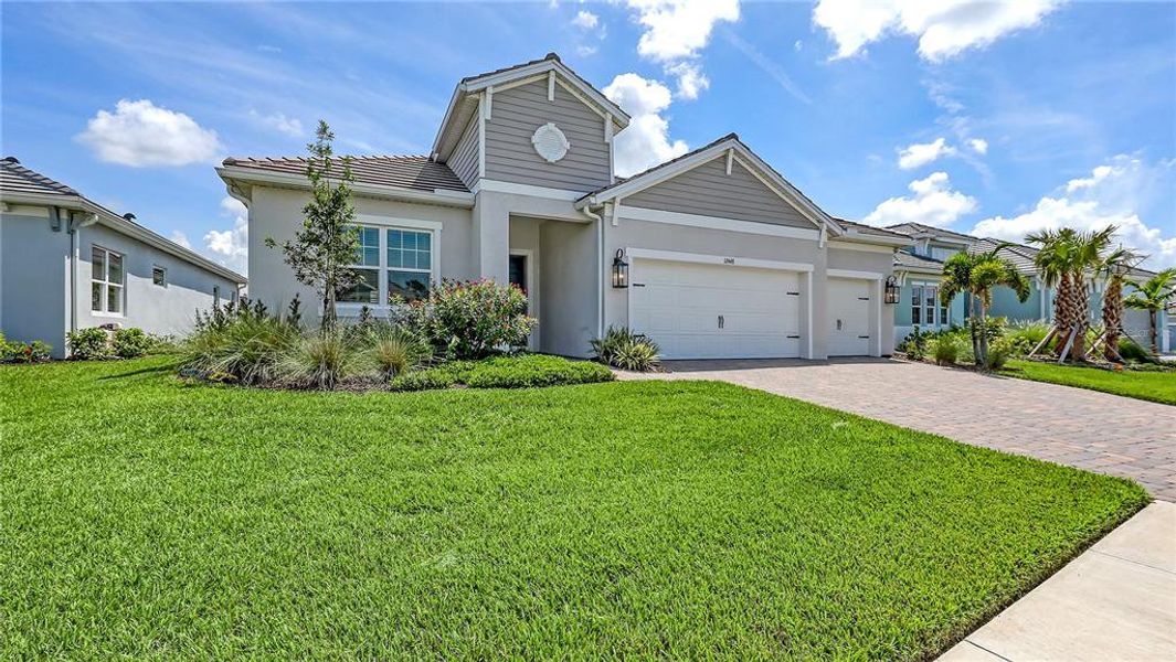 Front exterior of a new home in , Venice, FL, highlighting curb appeal (Image 22).