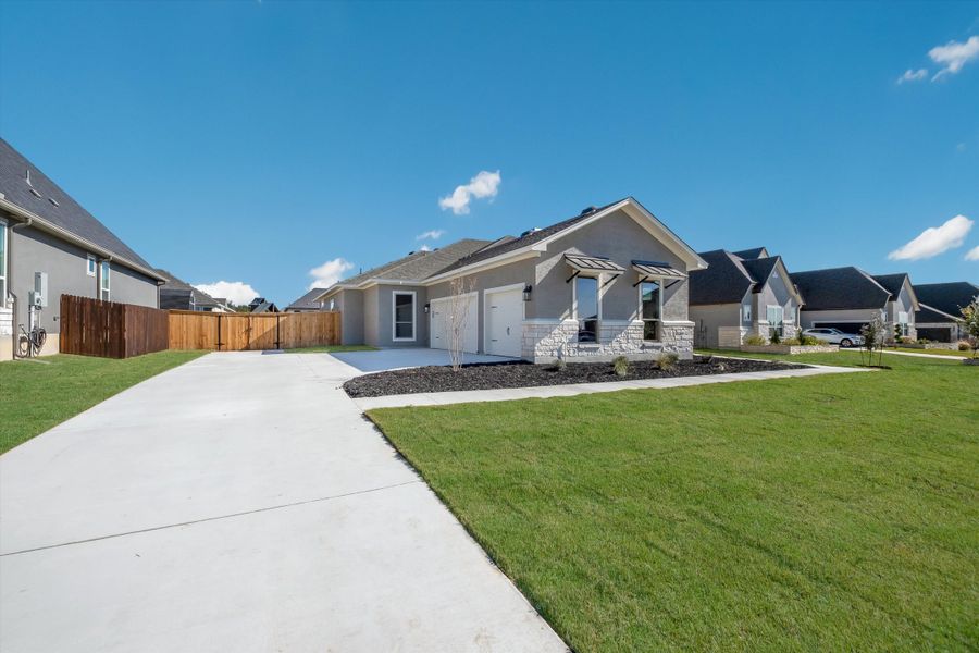Front exterior of a new home in Harvest Hills, Marion, TX, highlighting curb appeal (Image 19).