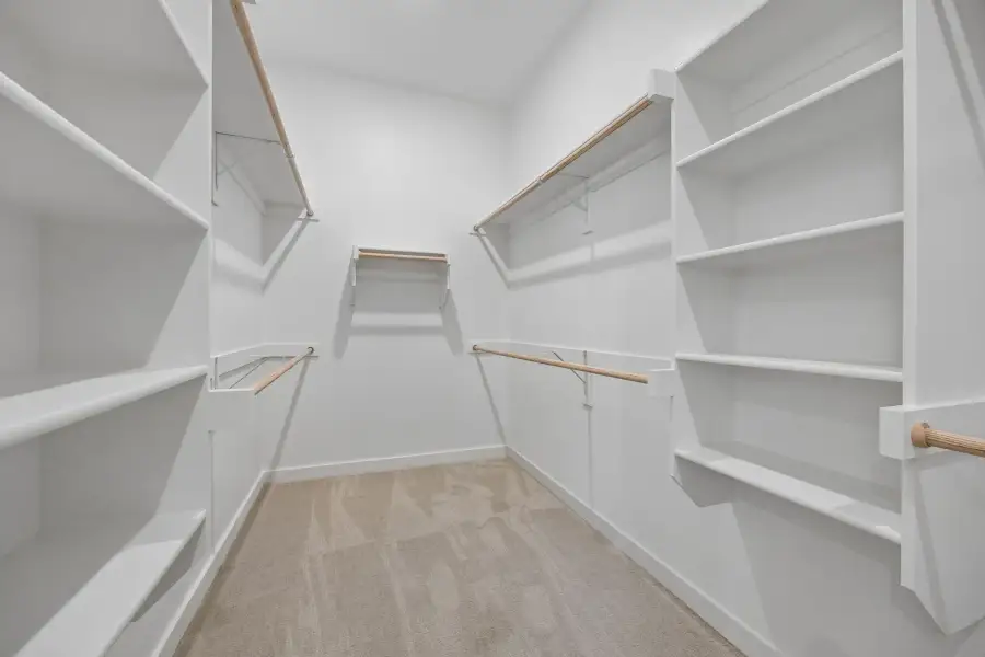 Primary Closet in the Monet II home plan by Trophy Signature Homes – REPRESENTATIVE PHOTO Primary Closet in the Monet II home plan by Trophy Signature Homes – REPRESENTATIVE PHOTO