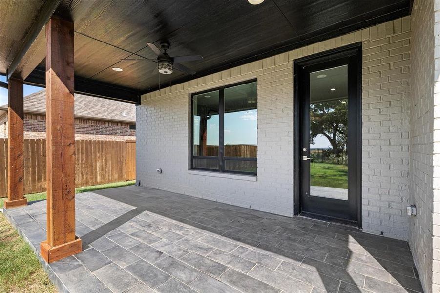 View of patio featuring ceiling fan