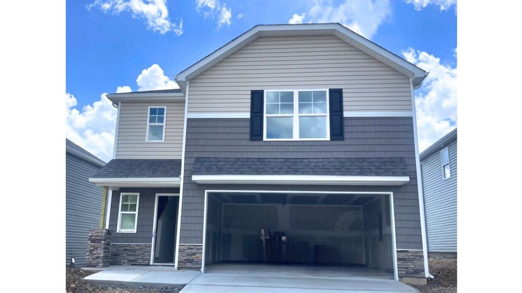 Front exterior of a new home in Johnson Farms, Greeneville, TN, highlighting curb appeal (Image 1).