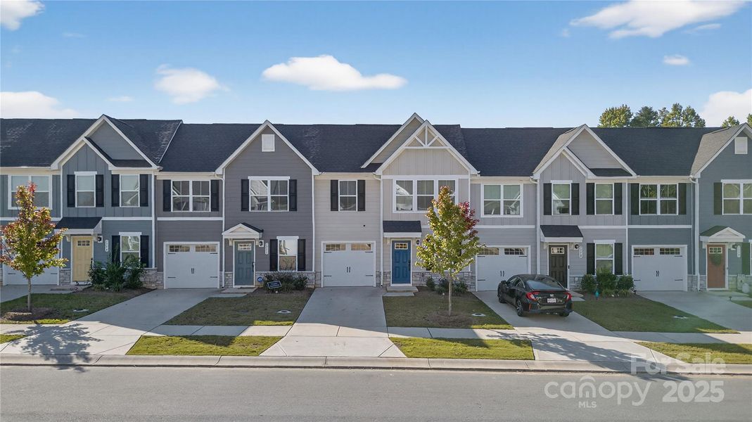 Front exterior of a new home in , Troutman, NC, highlighting curb appeal (Image 1).