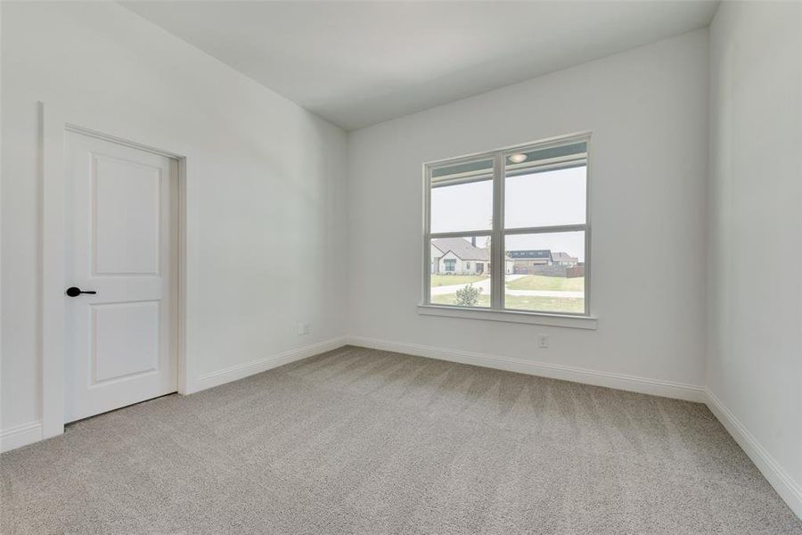 Unfurnished room with carpet floors