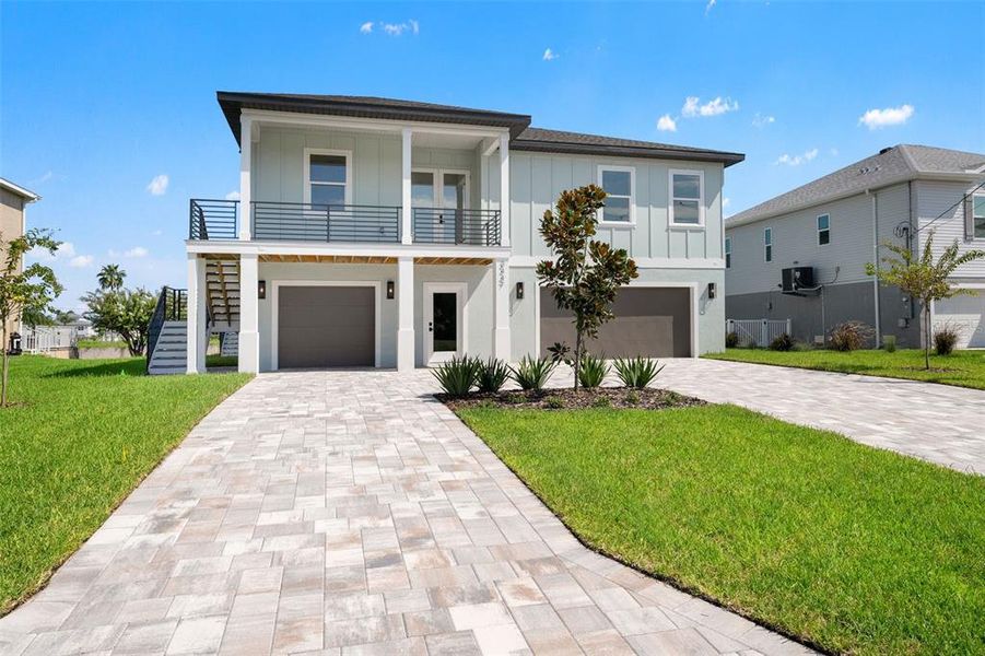 Front exterior of a new home in , Hernando Beach, FL, highlighting curb appeal (Image 26). Front exterior of a new home in , Hernando Beach, FL, highlighting curb appeal (Image 26).