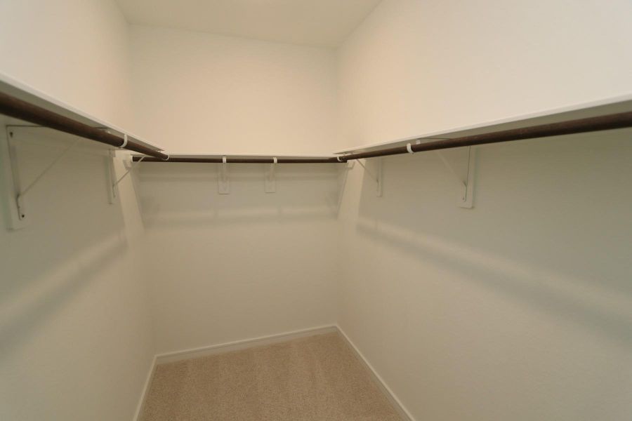 Huge primary walk-in closet Huge primary walk-in closet