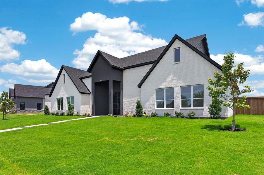 Front exterior of a new home in , Forney, TX, highlighting curb appeal (Image 2). Front exterior of a new home in , Forney, TX, highlighting curb appeal (Image 2).
