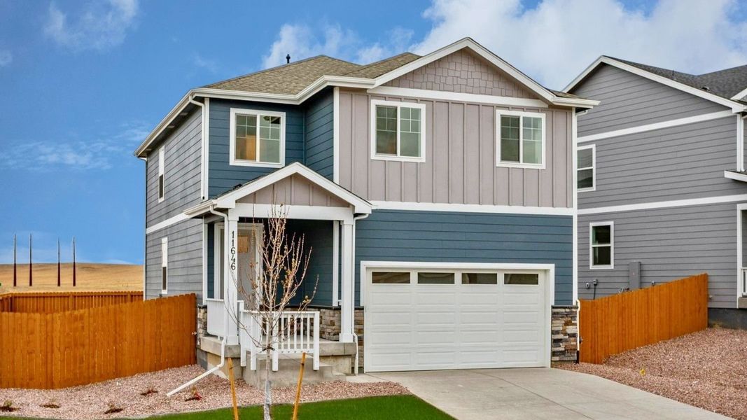 Front exterior of a new home in Ridge at Johnstown, Johnstown, CO, highlighting curb appeal (Image 1). Front exterior of a new home in Ridge at Johnstown, Johnstown, CO, highlighting curb appeal (Image 1).