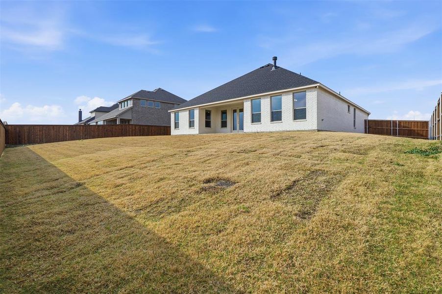 Exterior details and patio area of a home in Wildcat Ridge, Godley (Image 24).