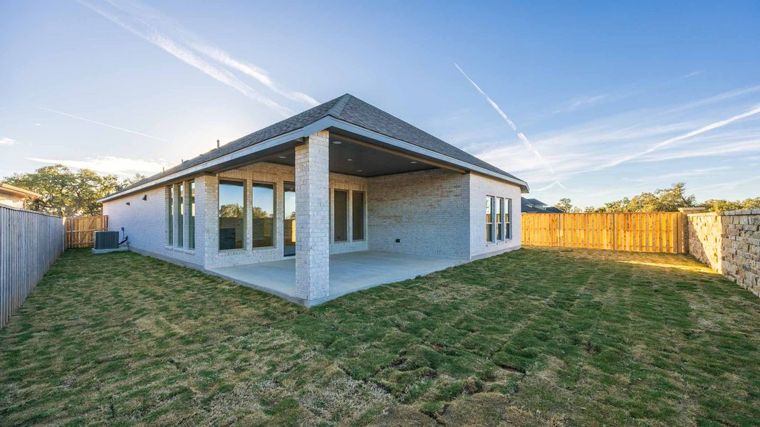Exterior details and patio area of a home in Parmer Ranch 50', Georgetown (Image 3).