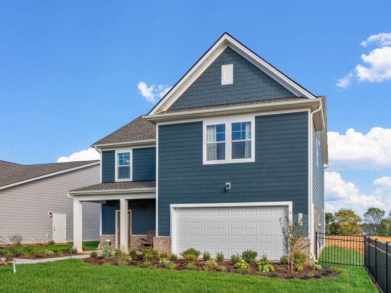 Front exterior of a new home in Sage Farms, White House, TN, highlighting curb appeal (Image 21). Front exterior of a new home in Sage Farms, White House, TN, highlighting curb appeal (Image 21).