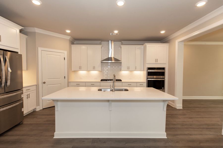 Representative furnished interior of a home built from the The Charleston by The Providence Group in Aberdeen, Hoschton (Image 8).