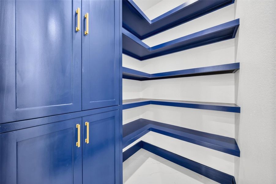 Built in cabinetry and shelving provide convenient storage and organization