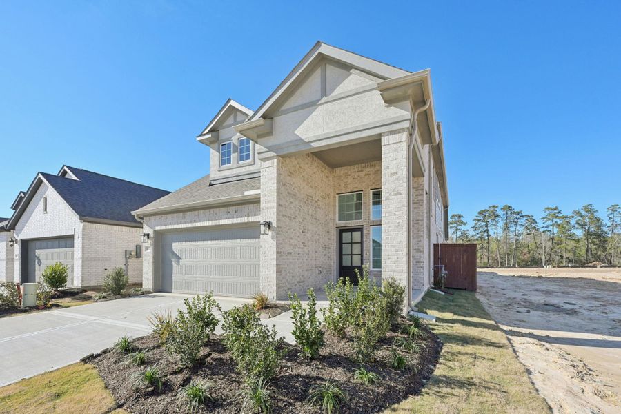 Front exterior of a new home in Evergreen, Conroe, TX, highlighting curb appeal (Image 14).