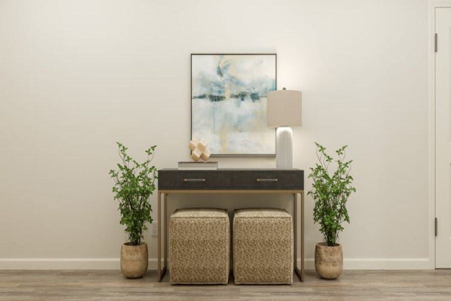 A desk with a plant and a chair in front of it. A desk with a plant and a chair in front of it.