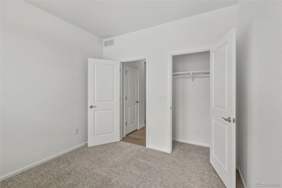 Spacious, unfurnished interior of a new home in The Cottages Collection at Ridgeline Vista, Brighton (Image 17).